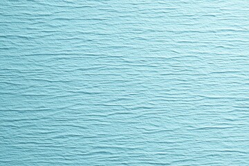 Textured light blue background with subtle waves creates a calm and soothing atmosphere perfect for various design projects or digital media use