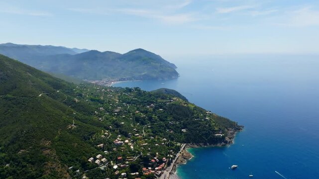 Panoramic drone shot rising along the of Bonassola, toward Levanto, Italy, summer