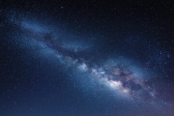 Fototapeta premium Milky Way galaxy shines brightly over a starry night sky in a remote area, inviting stargazers and astrophotographers to explore the wonders above