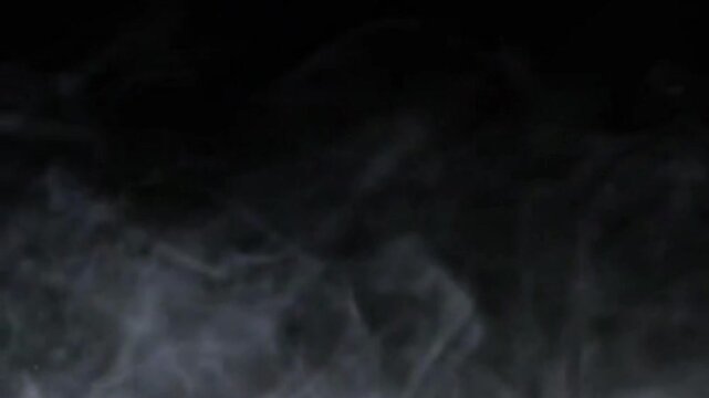 close up of white smoke on black background	