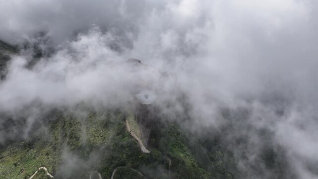 Citadelle Laferri&egrave;re, century fortress on mountaintop, historic landmark shrouded in clouds, Near Cap-Ha&iuml;tien, Haiti. Aerial tp-down orbiting