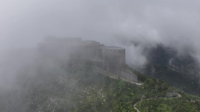 Citadelle Laferriere shrouded in clouds, Haiti. Aerial drone lateral view