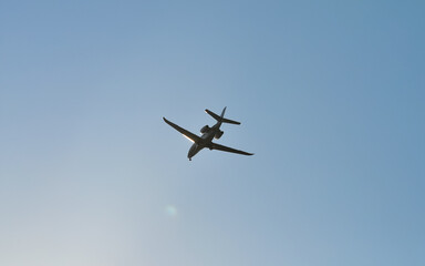 small plane flying low in the sky with space for text