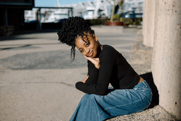 Fototapeta premium Young Black Female smiling and coy