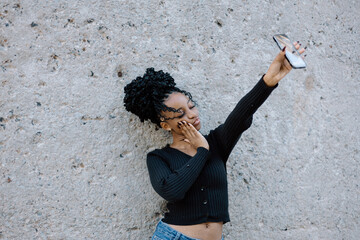Black female posing and taking a selfie