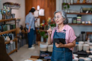 Mother, son and daughter are working at their DIY store.