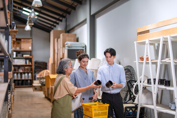 Mother, son and daughter are working at their DIY store.