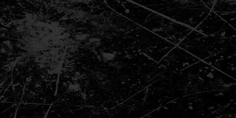 Abstract grunge and grainy old stained and scratched dusty Black Texture with Fine Scratches and Dust. Old black toned grunge rough scratched textured wall, Empty surface of Black stone or grunge.