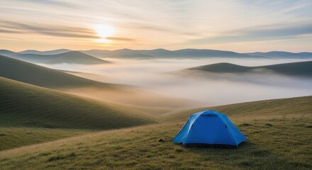 Blue Tent in a Mountain Landscape during Sunrise with Fog
