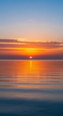 Fototapeta premium Magnificent sunset reflecting across ocean waters with soft cloudscape