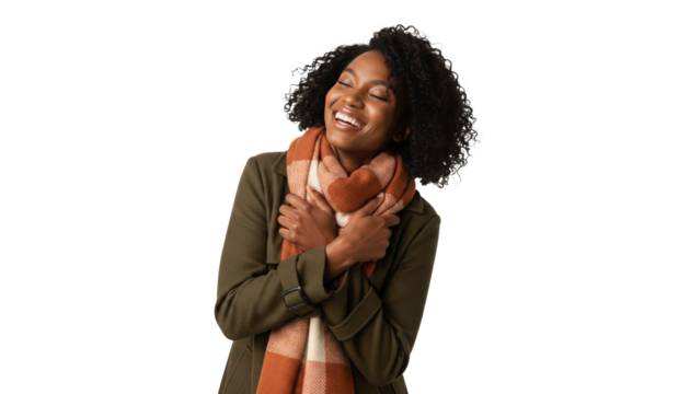 Happy African American woman embracing warmth in cozy scarf, feeling content and joyful this winter season