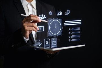 Businessman using digital tablet with virtual task icons for time management, project planning, productivity, team collaboration data analysis in modern workplace or remote work setting.