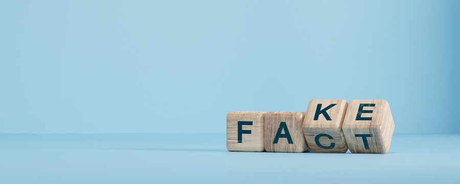 Flipping Wooden cube block for change fake to fact , news and social media concept.