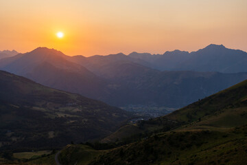 Summer sunset over Saint-Lary-Soulan and Aure Valley seen from the Col d&rsquo;Azet