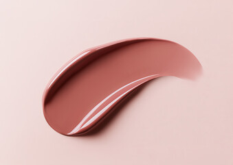 Terracotta brown lip gloss swatch on pastel background. Close-up of liquid lipstick, glossy texture, horizontal flatlay. Professional studio light