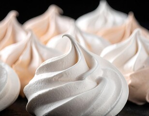 Close-up of delicate meringue cookies in cream and light beige tones