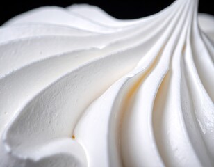Close-up view of delicate meringue swirls