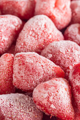 Pile of frozen strawberries for a background. Close-up