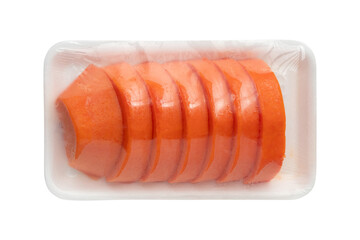 Freshly sliced ripe papaya pieces in plastic wrap on foam tray isolated on a transparent background
