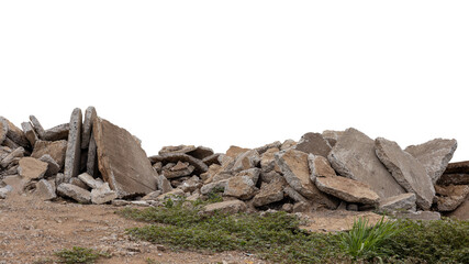 Close-up low angle view isolate of concrete debris, removed from road demolition and dumped on the ground, commonly seen in rural Thai road construction.