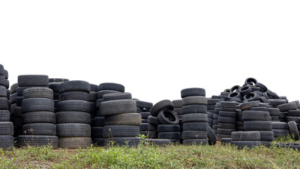 Low angle view of isolated piles of car tires left on the ground ready to be reused at a car repair shop, a common sight in rural Thailand.