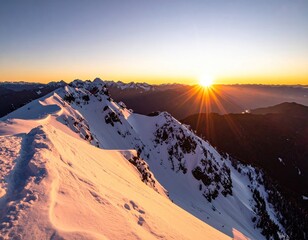 Snowy mountain peak at sunrise. Vast winter landscape with a majestic sunset