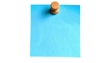 Blue paper note pinned by wooden tack to blank dark backdrop