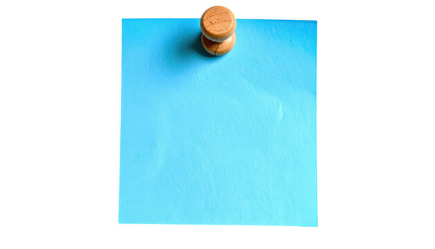 Blue paper note pinned by wooden tack to blank dark backdrop