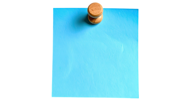 Blue paper note pinned by wooden tack to blank dark backdrop