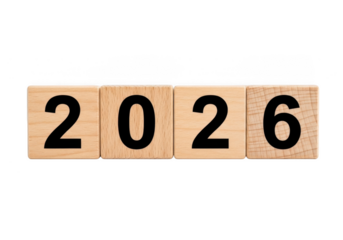 The year 2026 is spelled out with wooden blocks isolated on transparent background, representing the upcoming year and future events