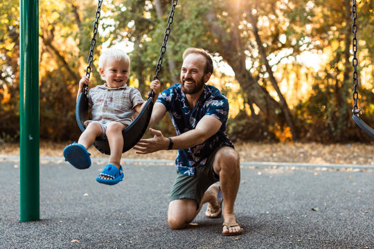 Father and Son at the Playground in Autumn