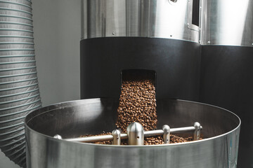 Roasted Coffee Beans Pouring Into Cooling Bin at Roastery