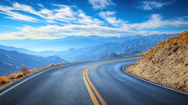 Curved road leading through mountains under a sunny blue, partly cloudy sky - Powered by Adobe