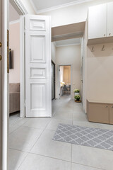Bright Hallway with Open Doors and Modern Interior