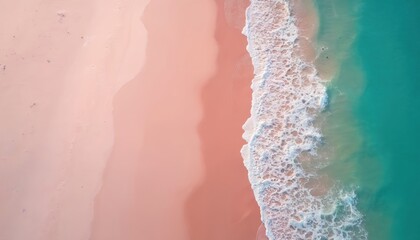 Drone view of pink sand beach meets turquoise ocean water with white foamy waves. Two swimmers enjoy sunbathing and swimming on a clear day.