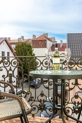 Romantic Balcony with Wine and Old Town View