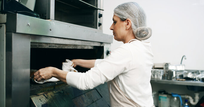 Restaurant, pastry chef and woman in commercial kitchen with oven, quality control and small business. Baker, order and stock for catering, bakery industry and production for breakfast or snack