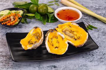 Baked oyster with cheddar cheese