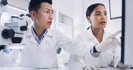 Lab, scientists and people with computer, planning and team with medical research and investigation. Science, collaboration and data collection on website, pointing and discussion for cure in clinic