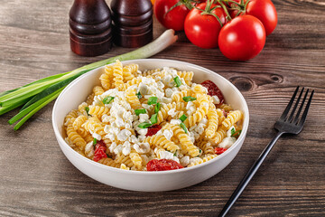 Italian pasta fusili with curd