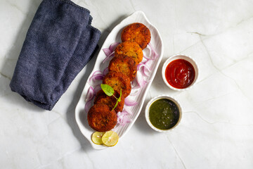 "Dahi ke kebab", a creamy, spiced yogurt patties mixed with herbs and breadcrumbs, shallow-fried to golden perfection, soft inside, crisp outside.
