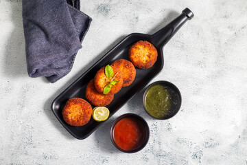 "Dahi ke kebab", a creamy, spiced yogurt patties mixed with herbs and breadcrumbs, shallow-fried to golden perfection, soft inside, crisp outside.
