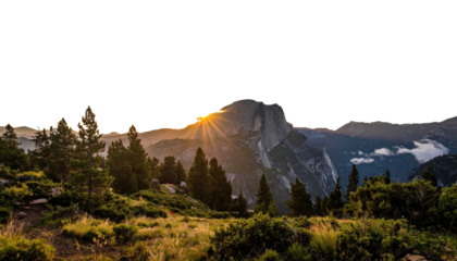 Mountain peak sunset behind trees on hill. Golden sun rays