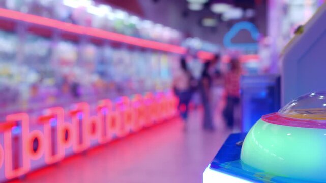 Vibrant Arcade Claw Machine Games with Glowing LED Lights in Indoor Amusement Venue