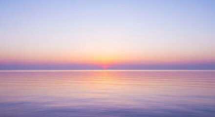 Obraz premium Calm Ocean at Sunset - Serene view of the ocean at sunset, featuring soft pastel colors reflecting on the water's surface, creating a peaceful and tranquil atmosphere