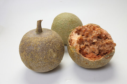 Hard shelled rare exotic fruit sour tangi wood apple kod bel on white background