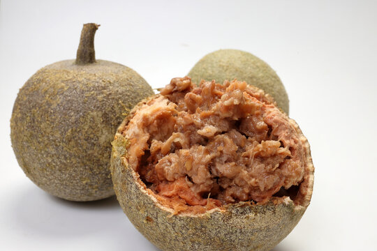 Hard shelled rare exotic fruit sour tangi wood apple kod bel on white background