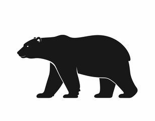 Fototapeta premium A black silhouette of a bear walking with its head and body visible.