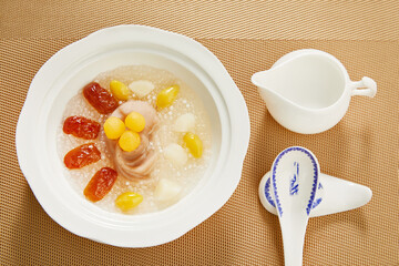 Chinese Sweet Soup with Taro Ice Cream and Mixed Fruits – Traditional Asian Dessert in White Bowl