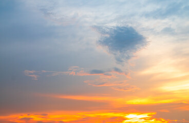 Fototapeta premium Sky sunset evening sunrise cloud weather dramatic landscape goldent and indigo color gradient pastel horizon, twilight yellow golden reflection morning nature environment energy ecosystem.